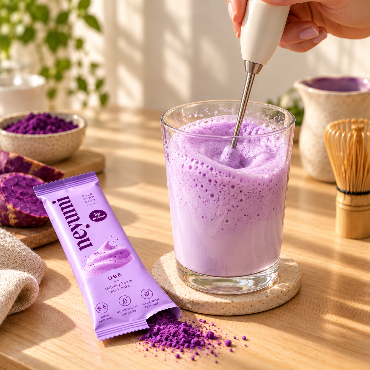 Frothing Neyumi powder with a handheld frother